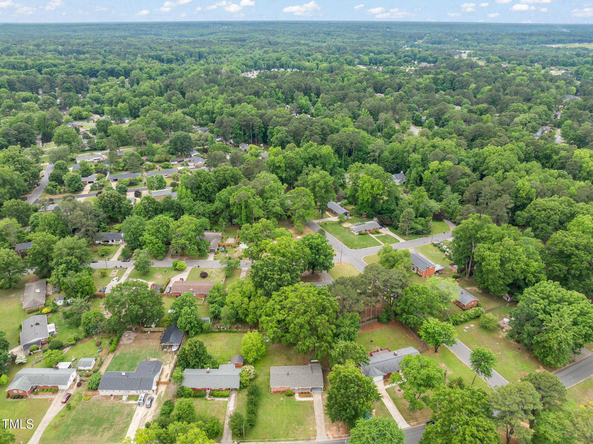 413 Winterlochen Road Raleigh, NC 27603 - Photo 35 of 44 an aerial view of residential houses with outdoor space and trees