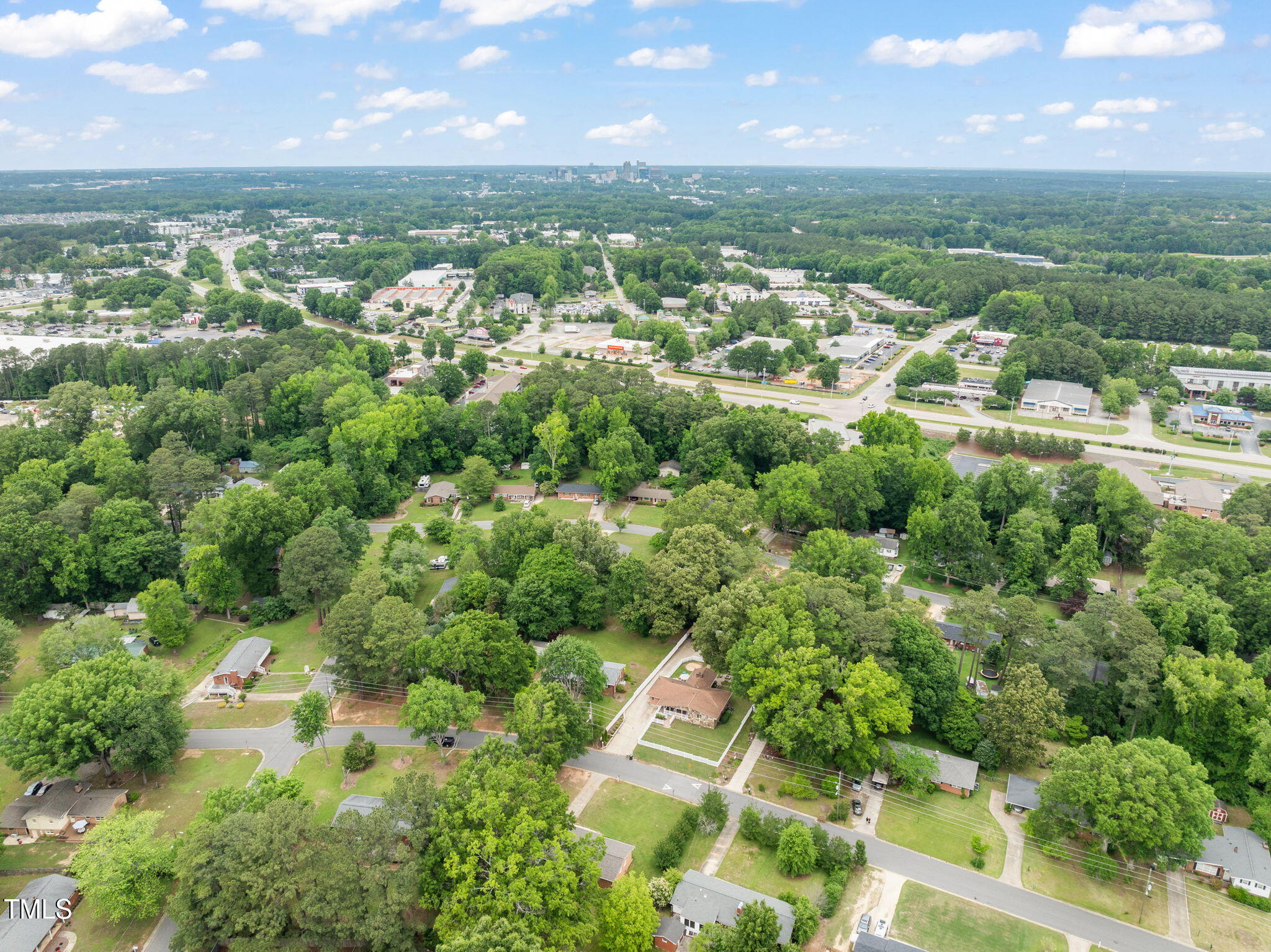 413 Winterlochen Road Raleigh, NC 27603 - Photo 38 of 44 an aerial view of residential houses with outdoor space and trees