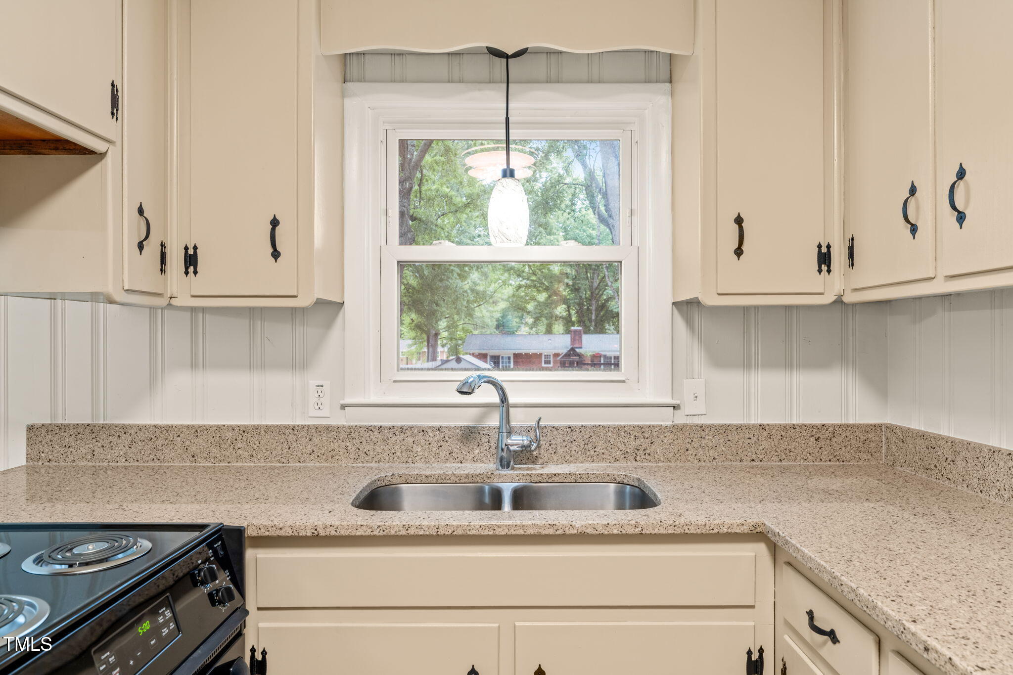 413 Winterlochen Road Raleigh, NC 27603 - Photo 4 of 44 a kitchen with appliances cabinets and a sink