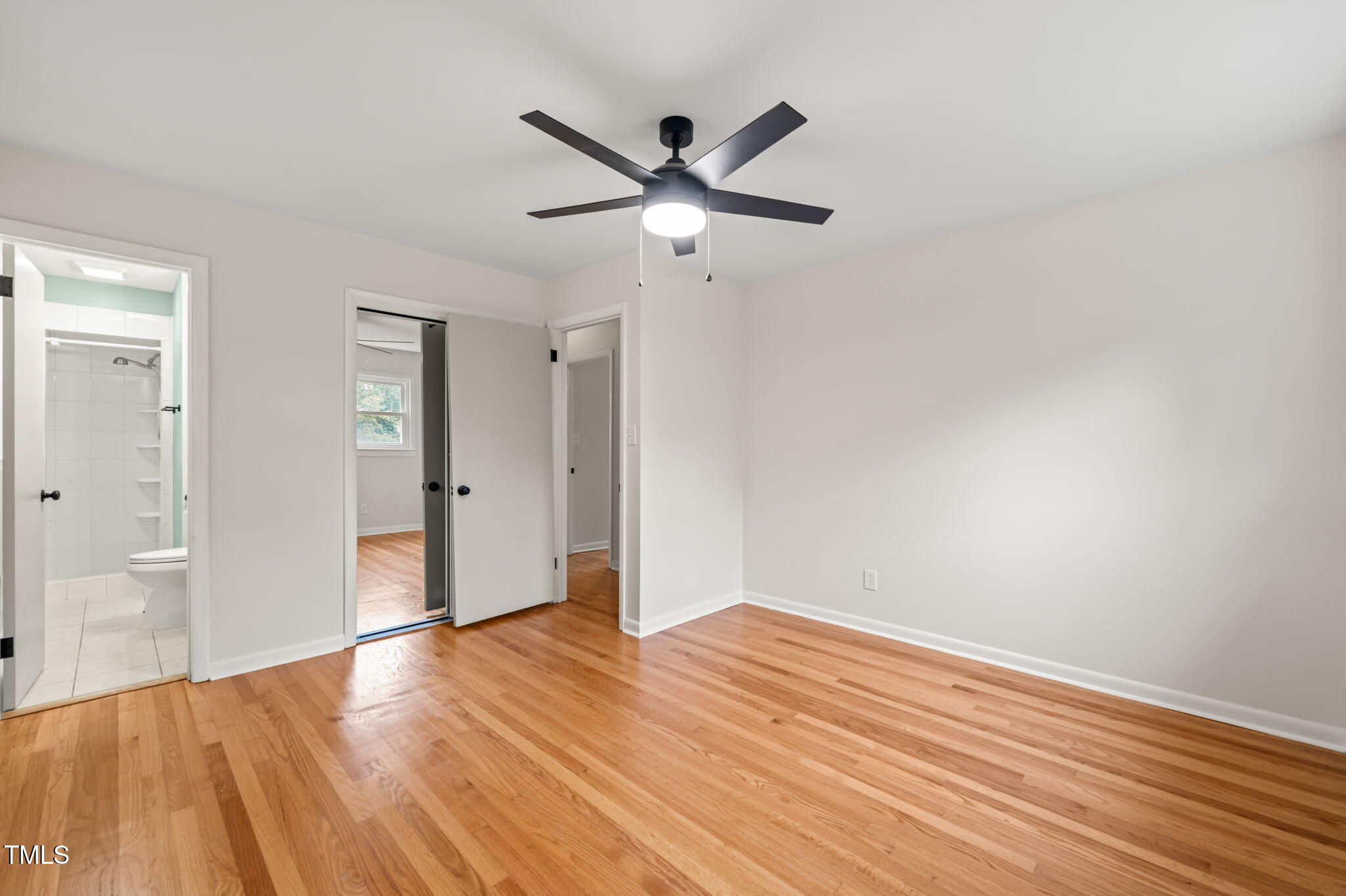 413 Winterlochen Road Raleigh, NC 27603 - Photo 7 of 44 a view of empty room with wooden floor