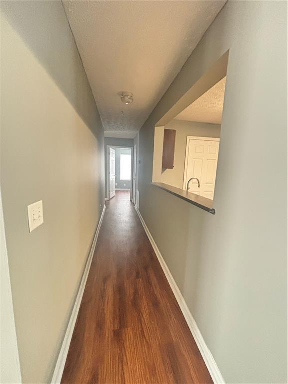 3101 Par 3 Way Lithonia, GA 30038 - Photo 17 of 32 a view of a hallway with wooden floor