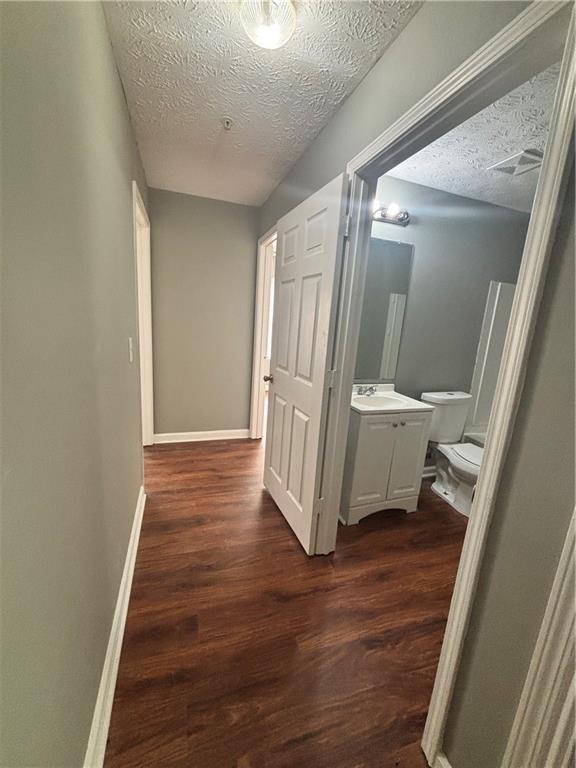 3101 Par 3 Way Lithonia, GA 30038 - Photo 21 of 32 a view of a hallway with wooden floor and stairs