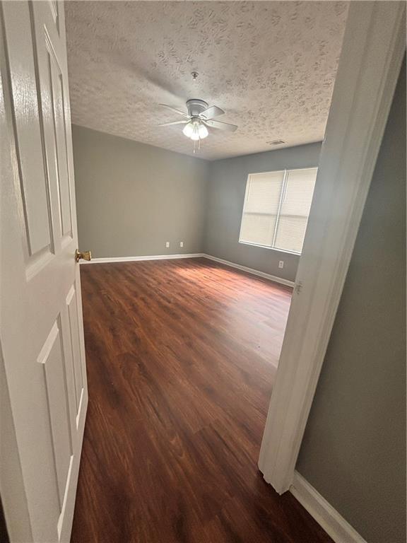 3101 Par 3 Way Lithonia, GA 30038 - Photo 22 of 32 wooden floor in an empty room with a window