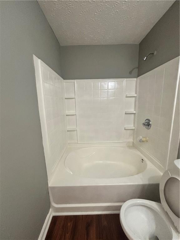 3101 Par 3 Way Lithonia, GA 30038 - Photo 26 of 32 a bathroom with a bathtub and toilet