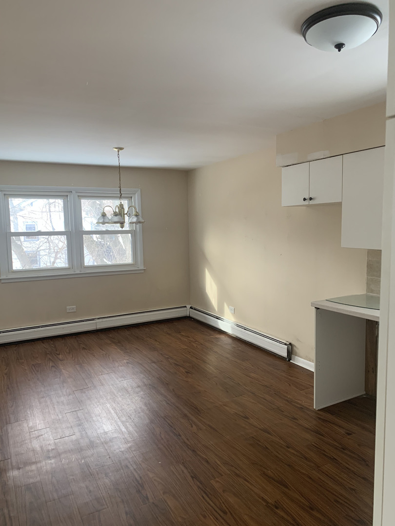 416 South Summit Street, Unit 2 Barrington, IL 60010 - Photo 11 of 13 an empty room with wooden floor and window