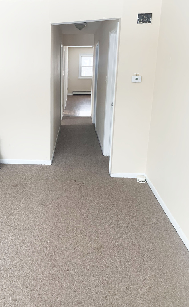 416 South Summit Street, Unit 2 Barrington, IL 60010 - Photo 5 of 13 an empty room with windows