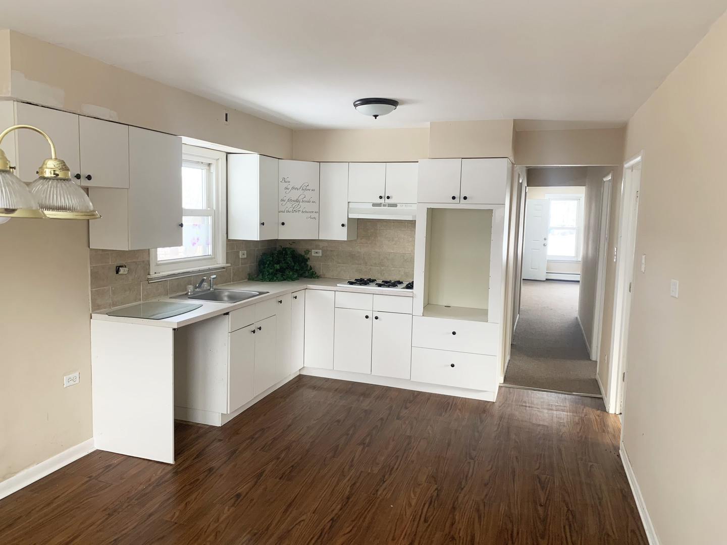 416 South Summit Street, Unit 2 Barrington, IL 60010 - Photo 7 of 13 a kitchen with white cabinets and white appliances