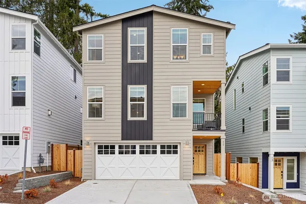 a front view of a house with garage