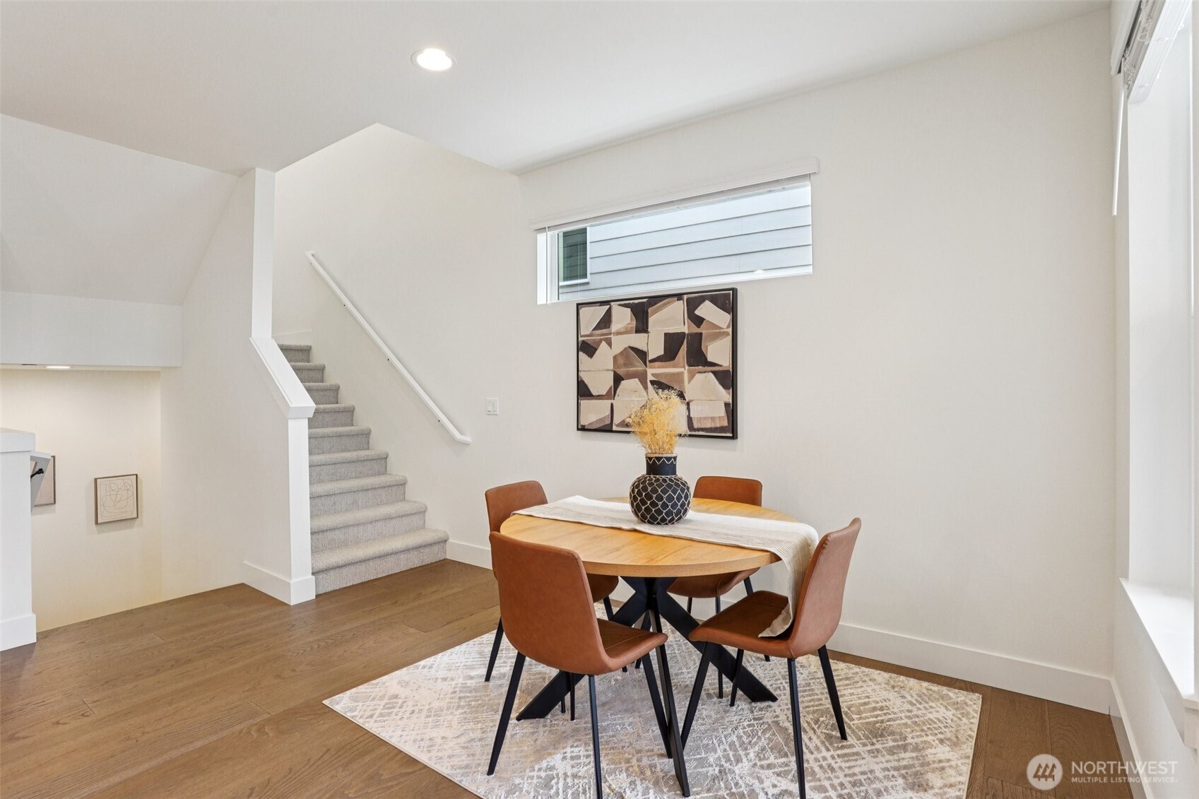 11 160th Place Southeast Bothell, WA 98012 - Photo 13 of 39 a dining room with furniture and wooden floor