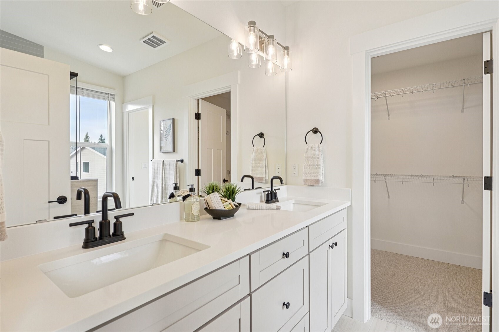 11 160th Place Southeast Bothell, WA 98012 - Photo 21 of 39 a bathroom with double vanity sink a mirror and shower