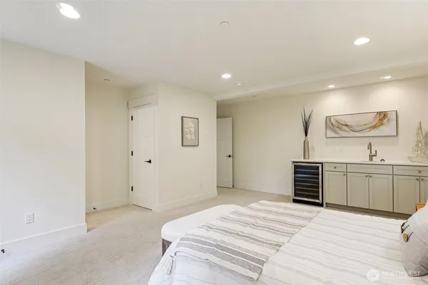 a bedroom with a bed and cabinets