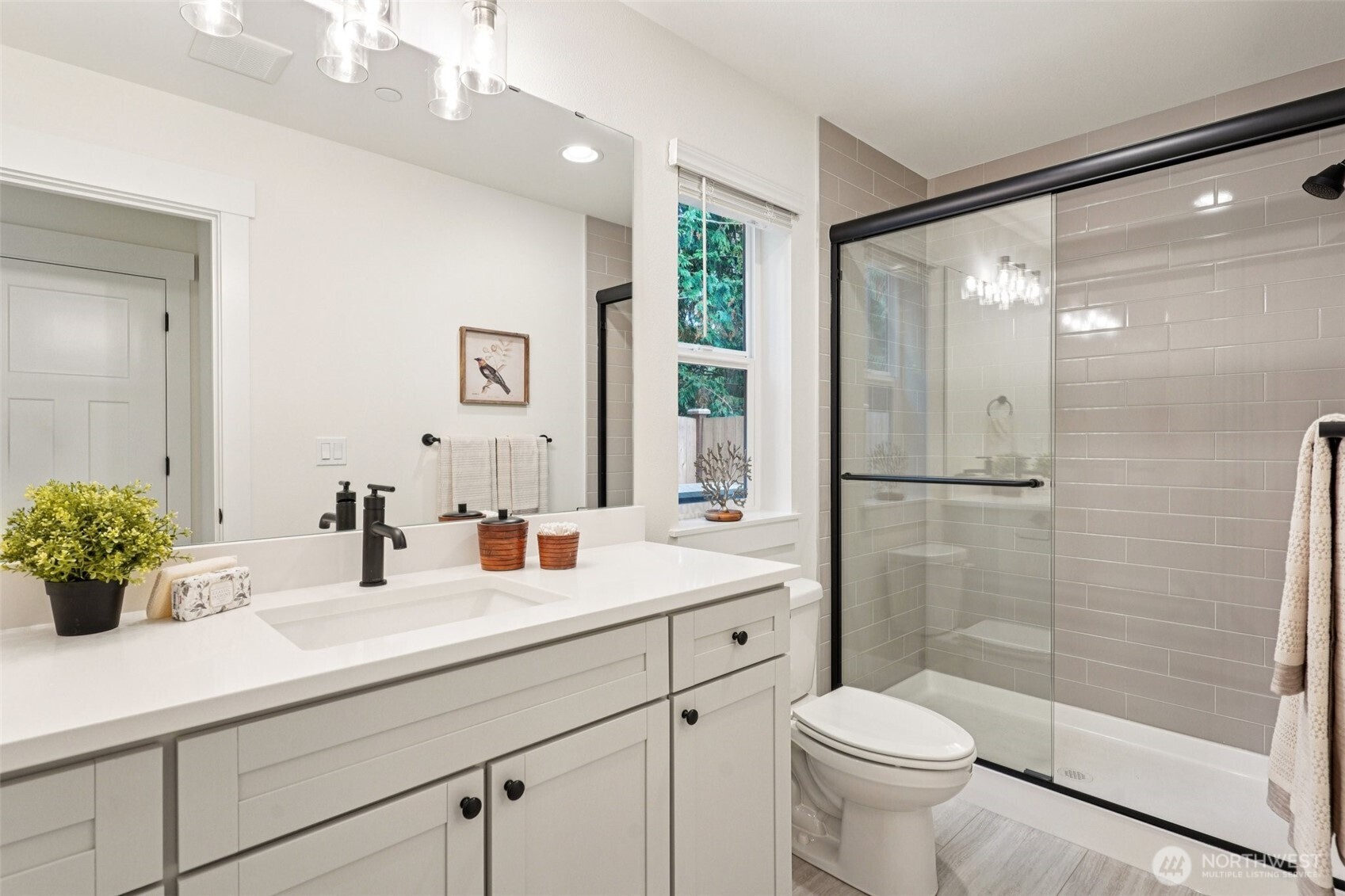 11 160th Place Southeast Bothell, WA 98012 - Photo 32 of 39 a bathroom with a double vanity sink toilet and shower