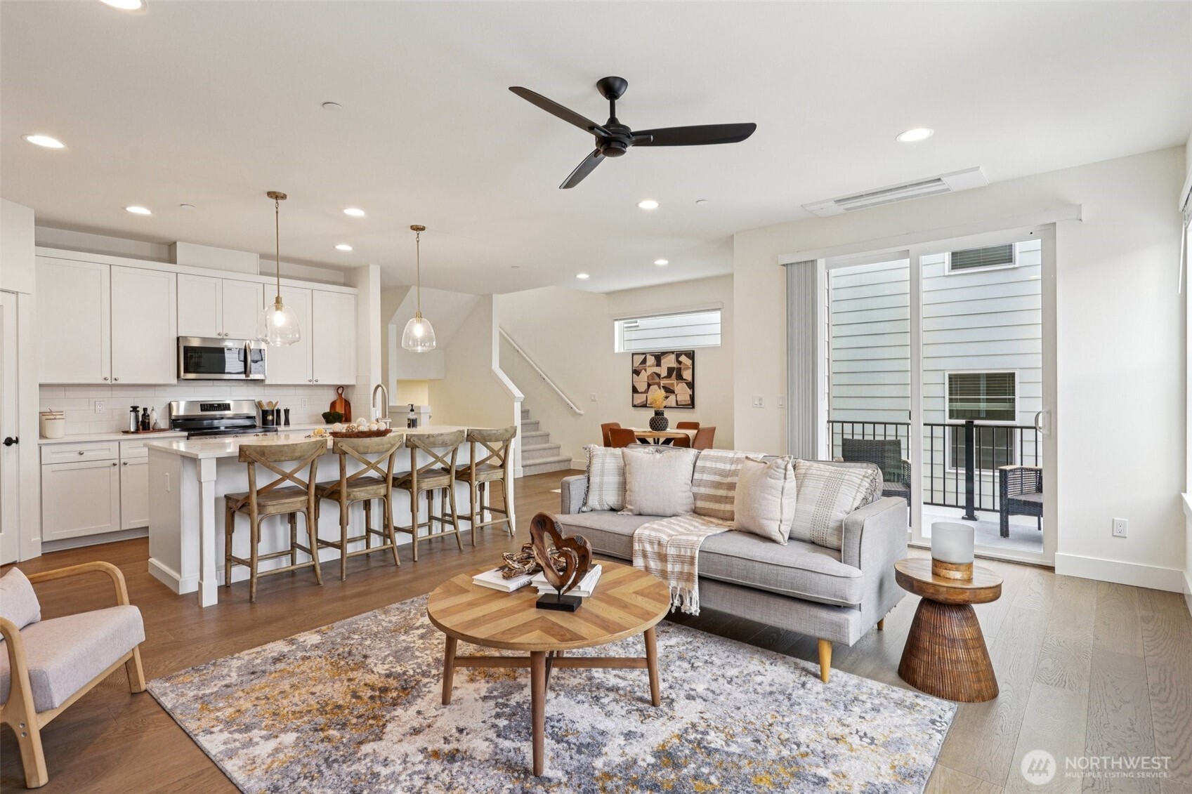 11 160th Place Southeast Bothell, WA 98012 - Photo 5 of 39 a living room with furniture kitchen view and a wooden floor