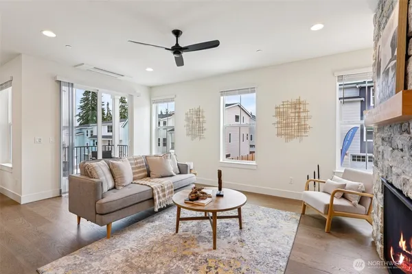 a living room with furniture a rug and a chandelier