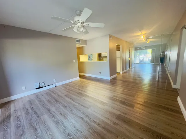 a view of a livingroom with wooden floor