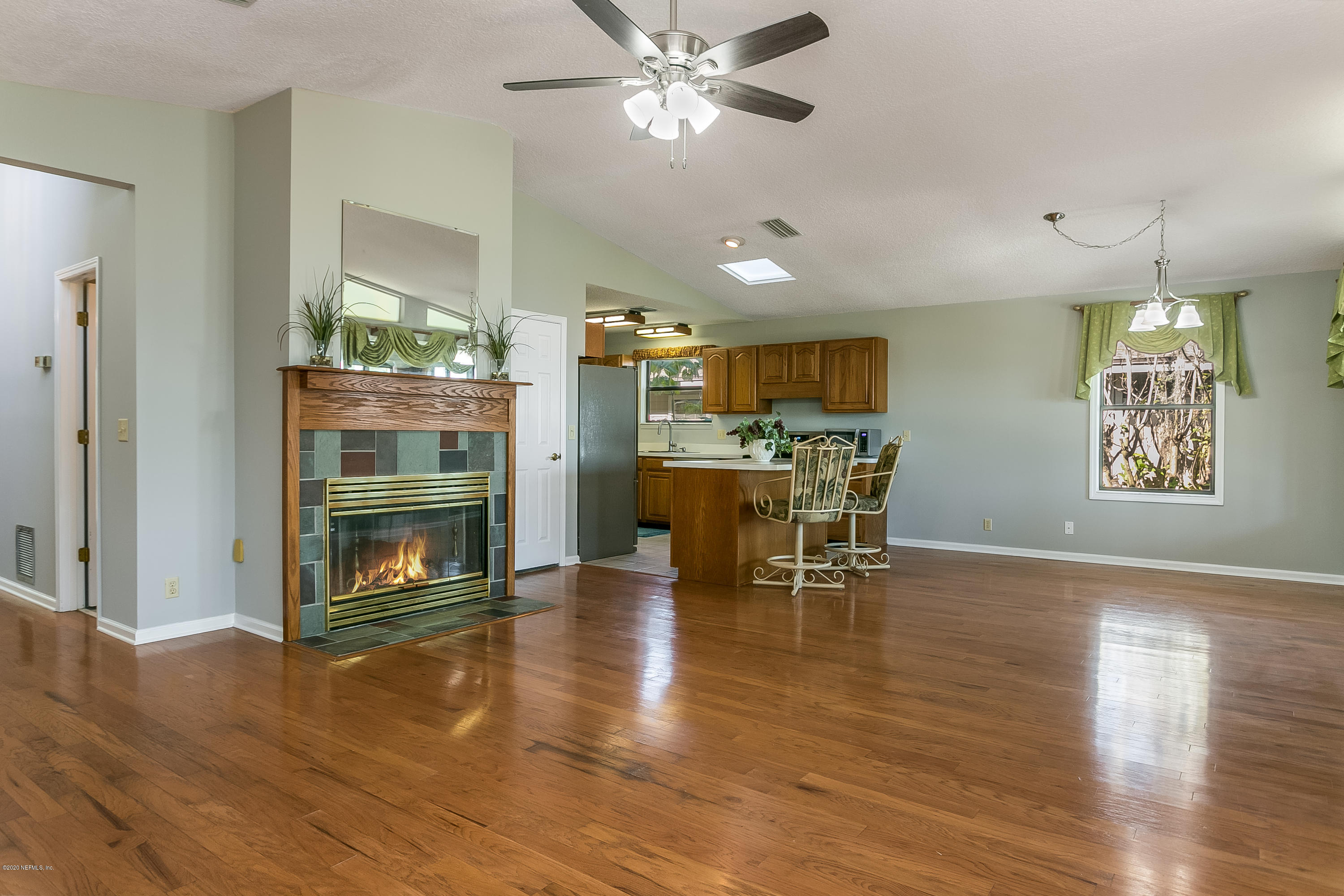 4239 Magnolia Road Orange Park, FL 32065 - Photo 11 of 40 a view of a dining room with furniture and wooden floor