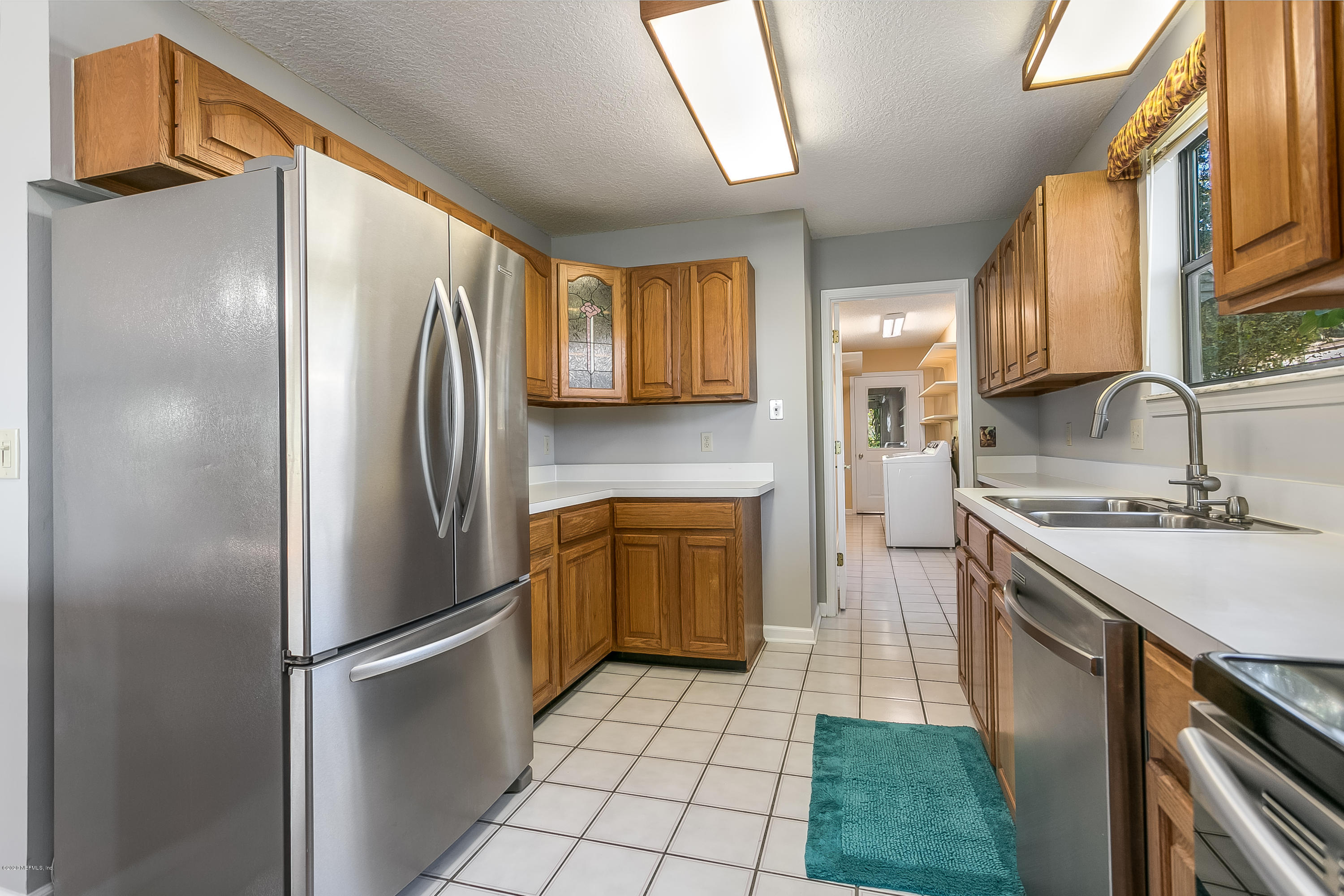 4239 Magnolia Road Orange Park, FL 32065 - Photo 14 of 40 a kitchen with a refrigerator sink and stove