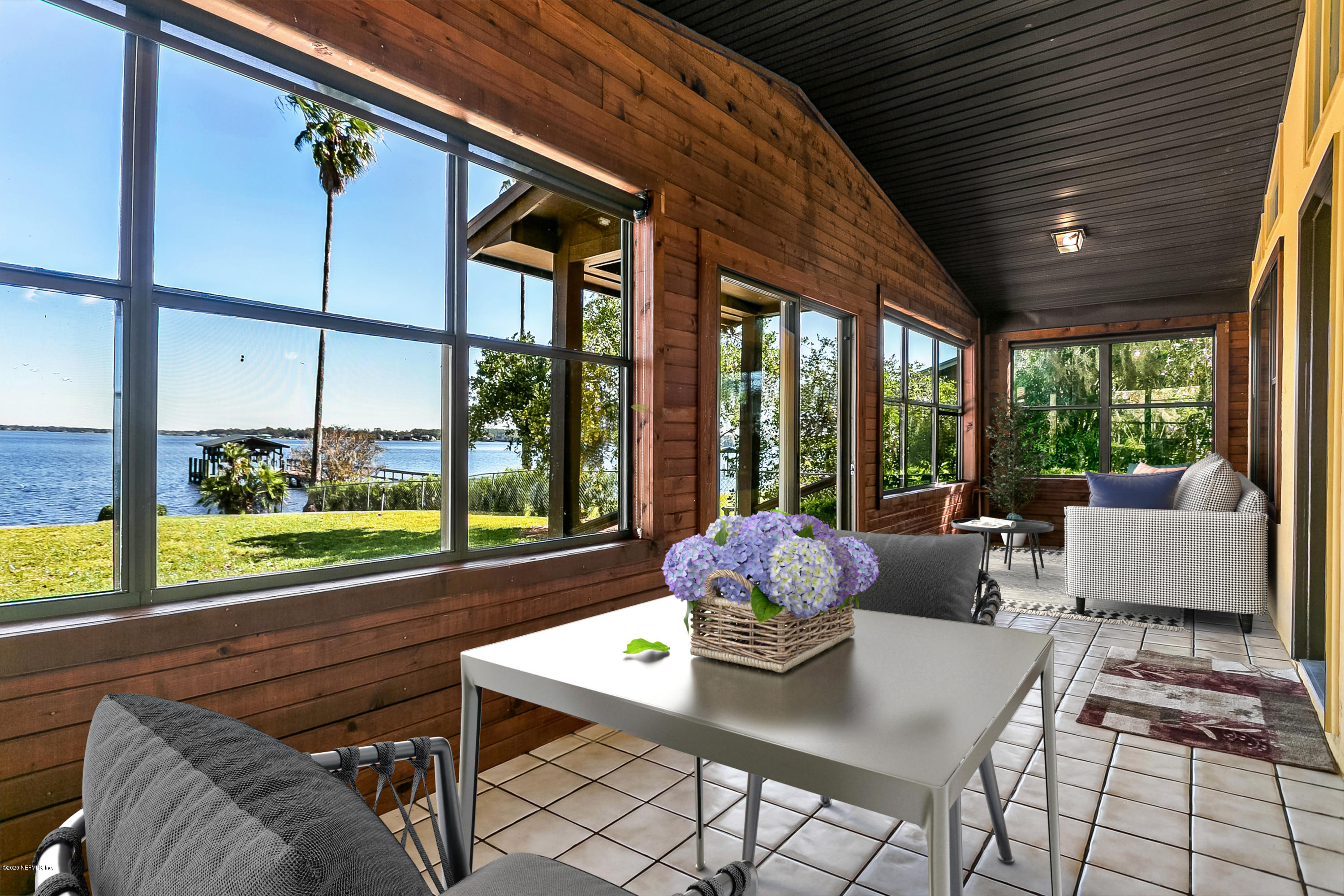 4239 Magnolia Road Orange Park, FL 32065 - Photo 15 of 40 a living room with furniture and floor to ceiling windows