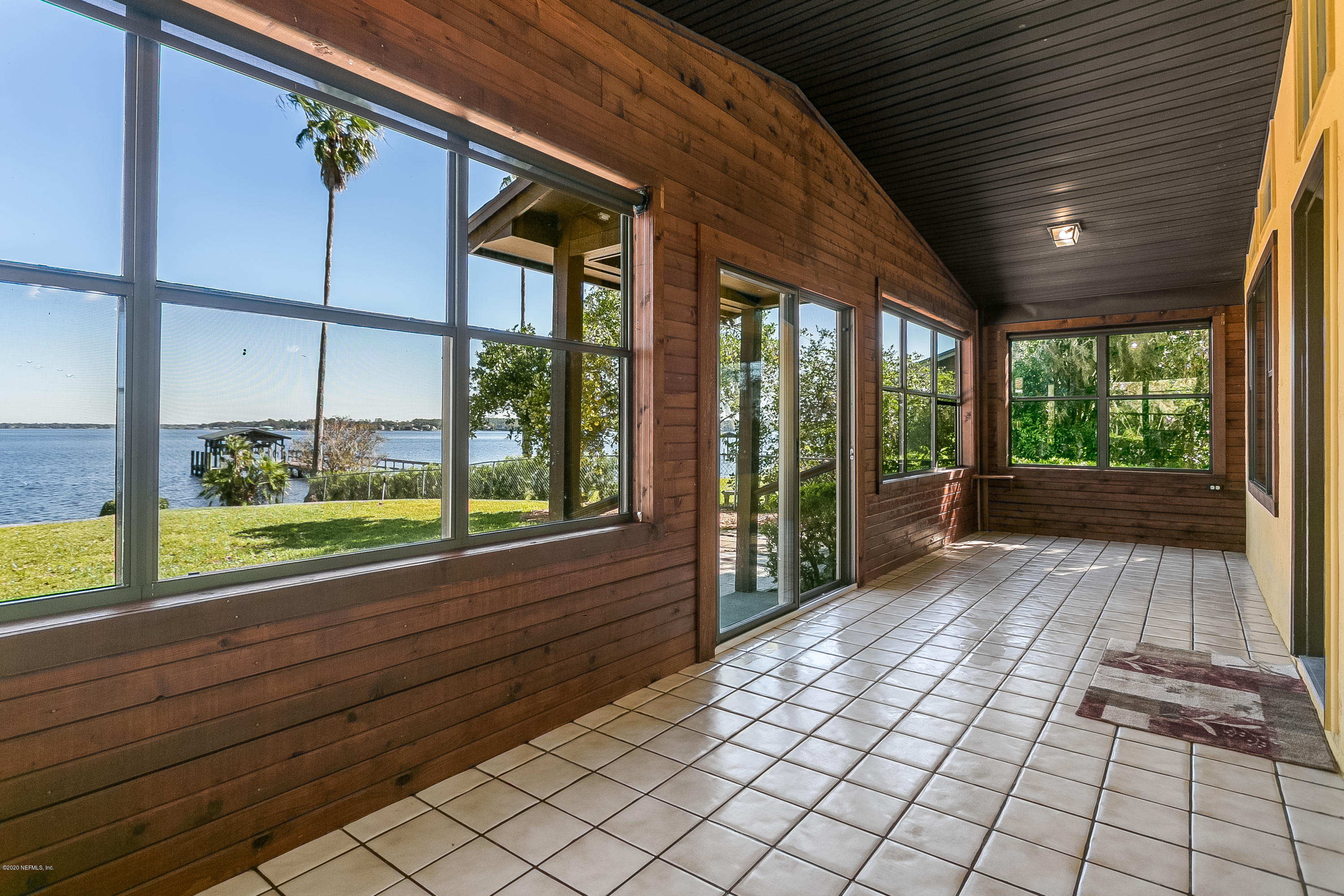 4239 Magnolia Road Orange Park, FL 32065 - Photo 16 of 40 a view of a room with wooden floor and iron stairs