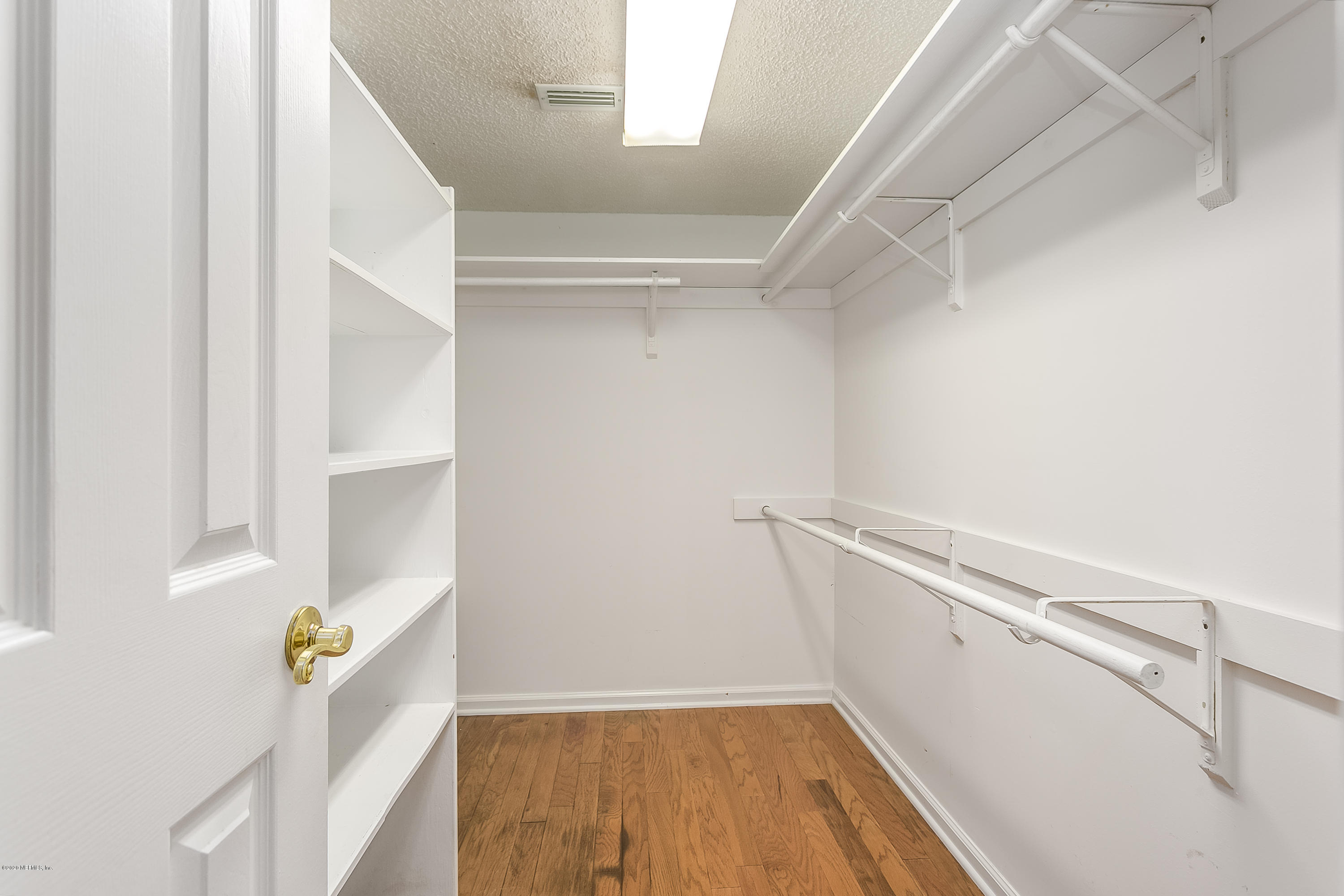 4239 Magnolia Road Orange Park, FL 32065 - Photo 24 of 40 a view of walk in closet with empty racks