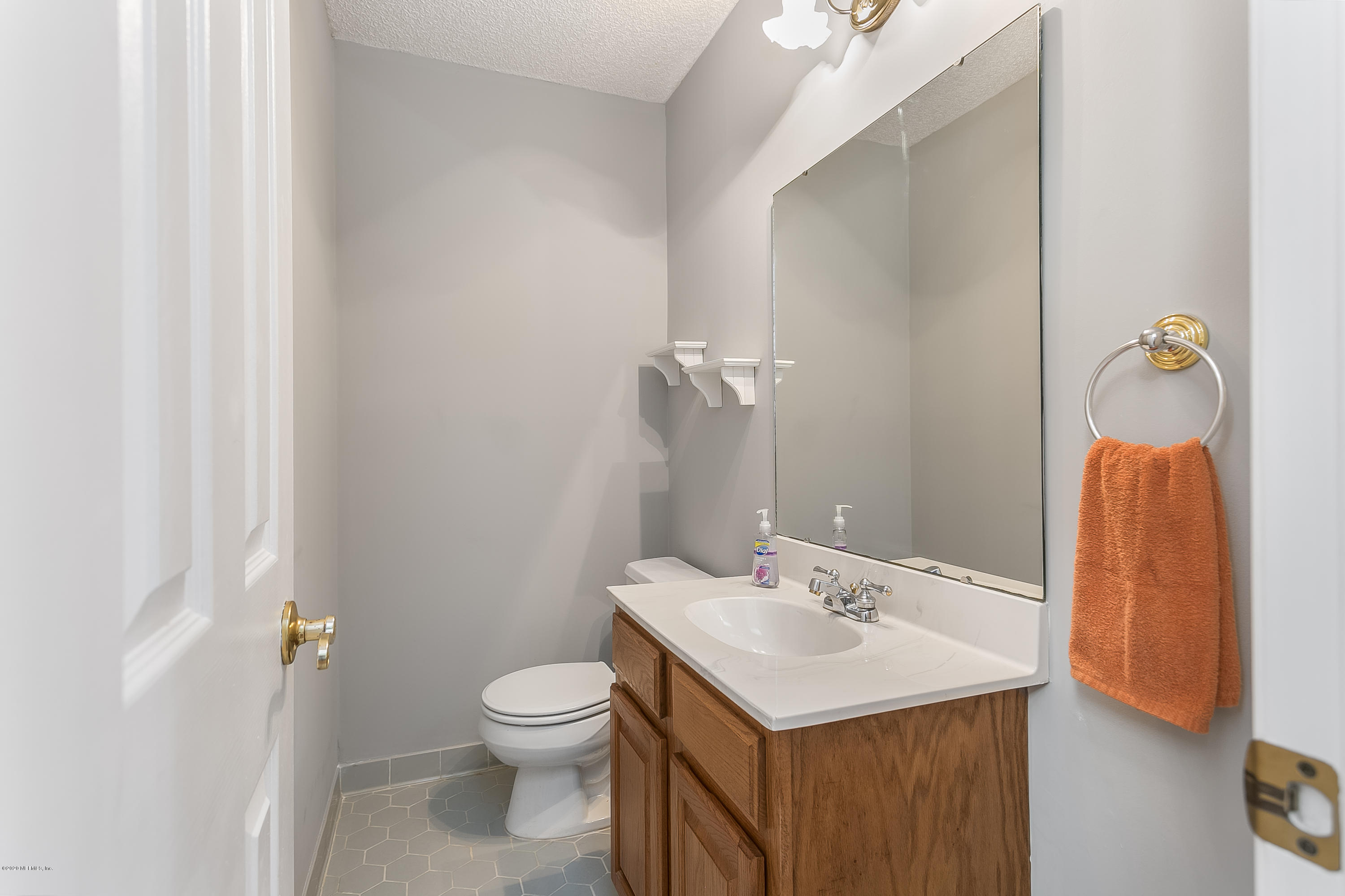 4239 Magnolia Road Orange Park, FL 32065 - Photo 25 of 40 a bathroom with a sink toilet and shower