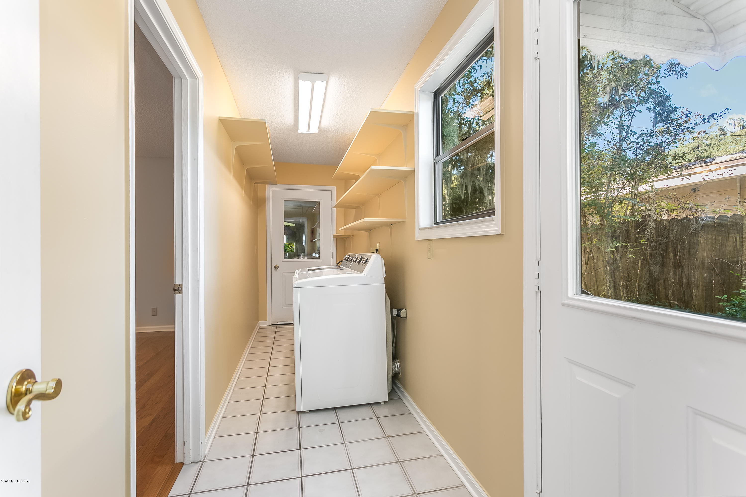 4239 Magnolia Road Orange Park, FL 32065 - Photo 30 of 40 a view of a hallway with windows