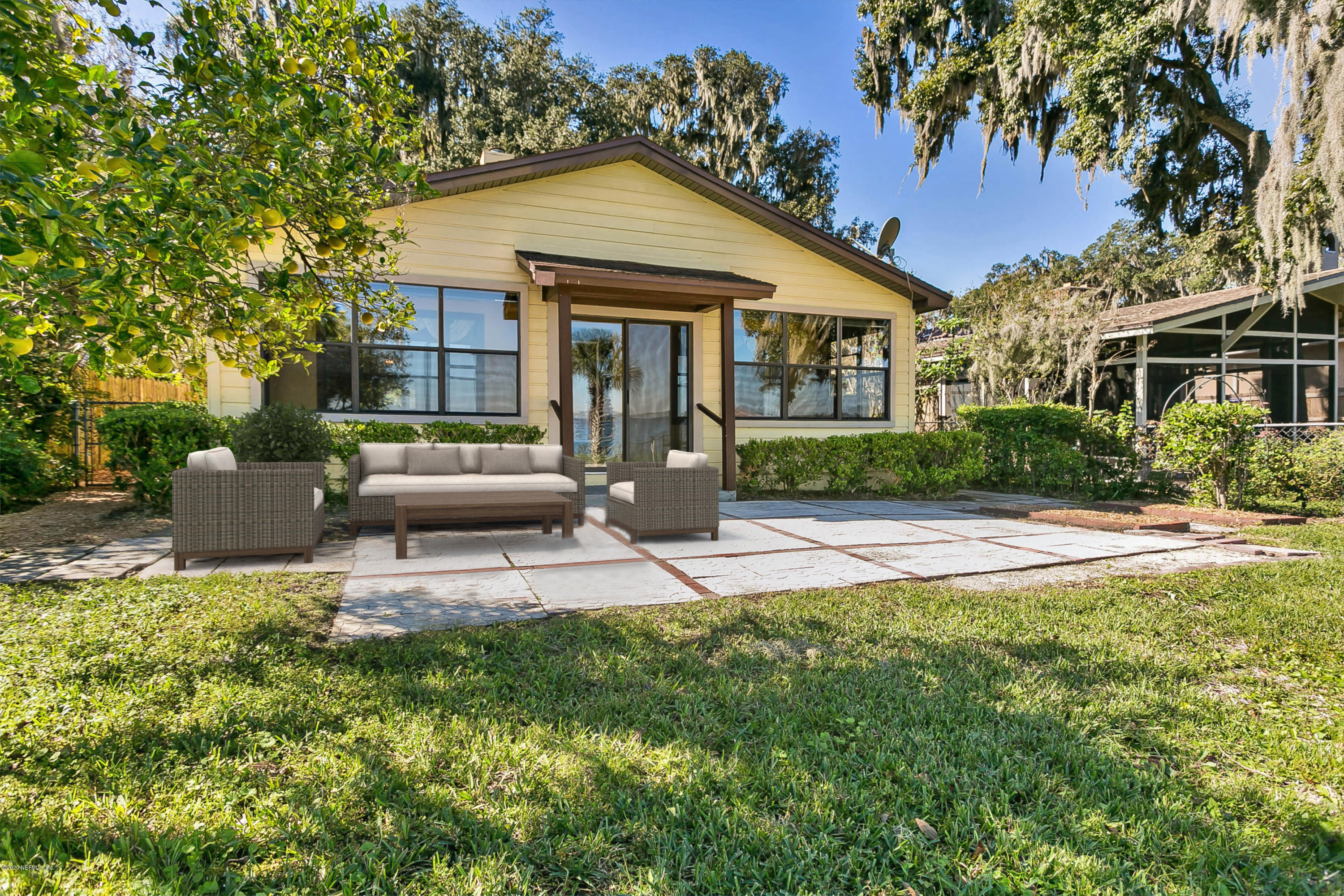 4239 Magnolia Road Orange Park, FL 32065 - Photo 31 of 40 a view of a house with backyard and sitting area
