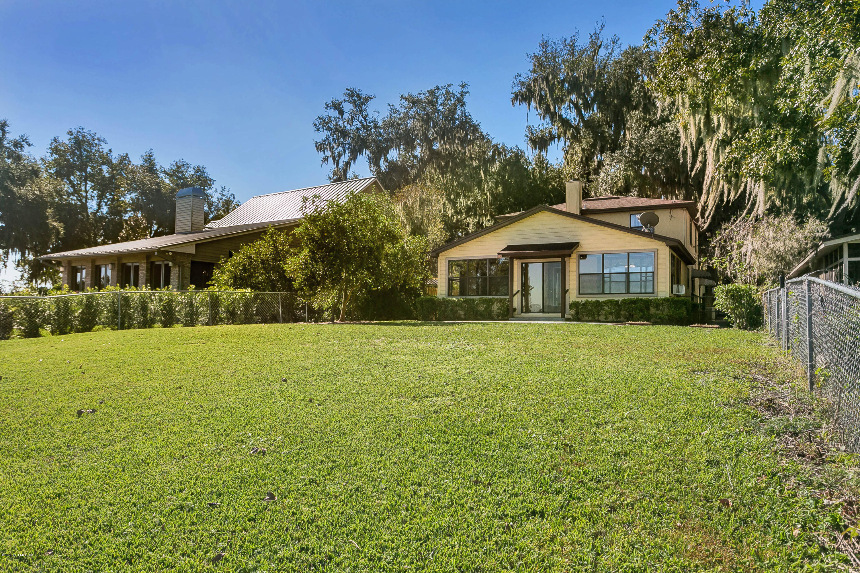 4239 Magnolia Road Orange Park, FL 32065 - Photo 32 of 40 a front view of a house with a yard