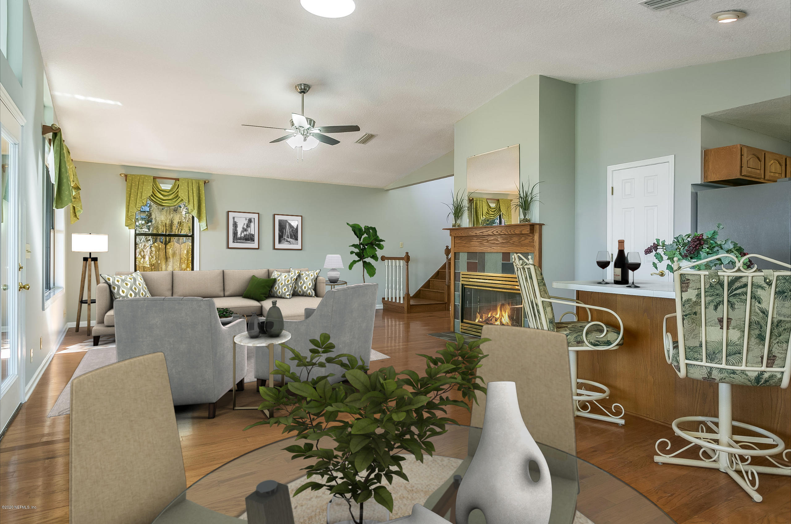 4239 Magnolia Road Orange Park, FL 32065 - Photo 8 of 40 a living room with furniture and a chandelier
