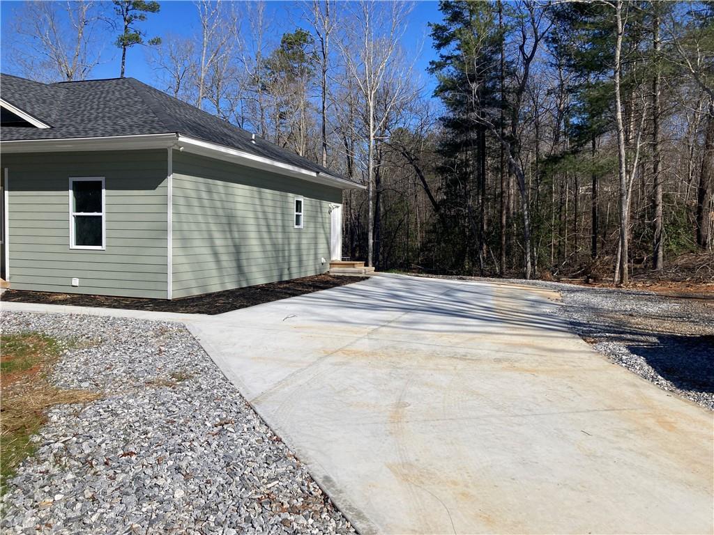 100 A Dickerson Road Dahlonega, GA 30533 - Photo 2 of 15 a side view of a house with a yard
