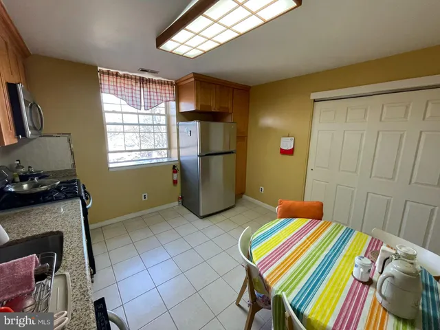 a bedroom with a bed and a fireplace