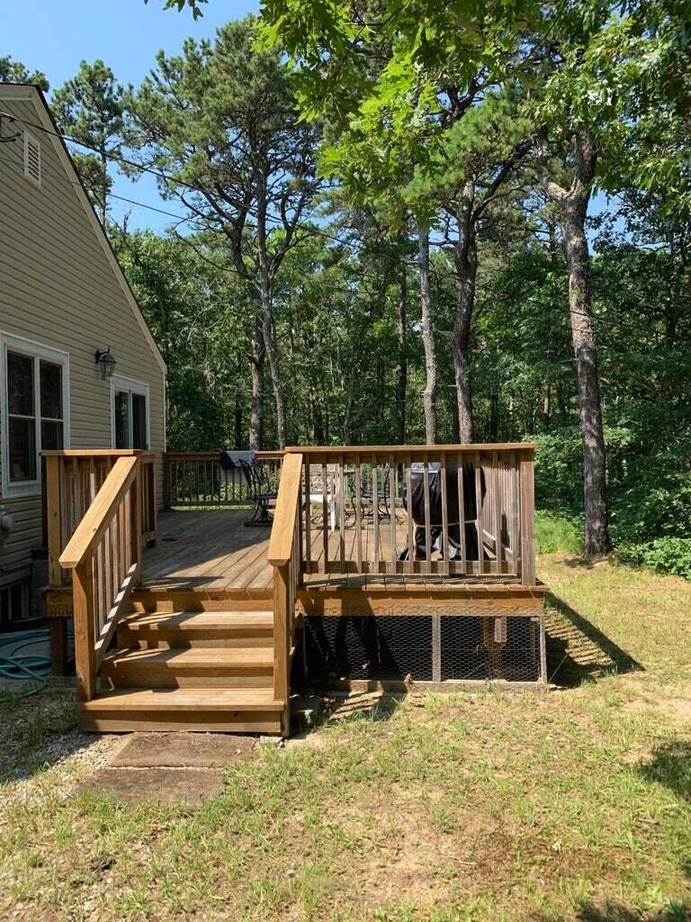 605 Cable Road Eastham, MA 02642 - Photo 13 of 25 a view of house with roof deck and furniture