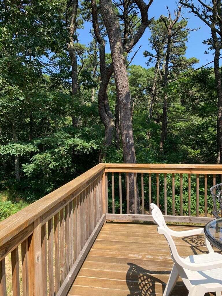 605 Cable Road Eastham, MA 02642 - Photo 15 of 25 a view of balcony with wooden floor and fence