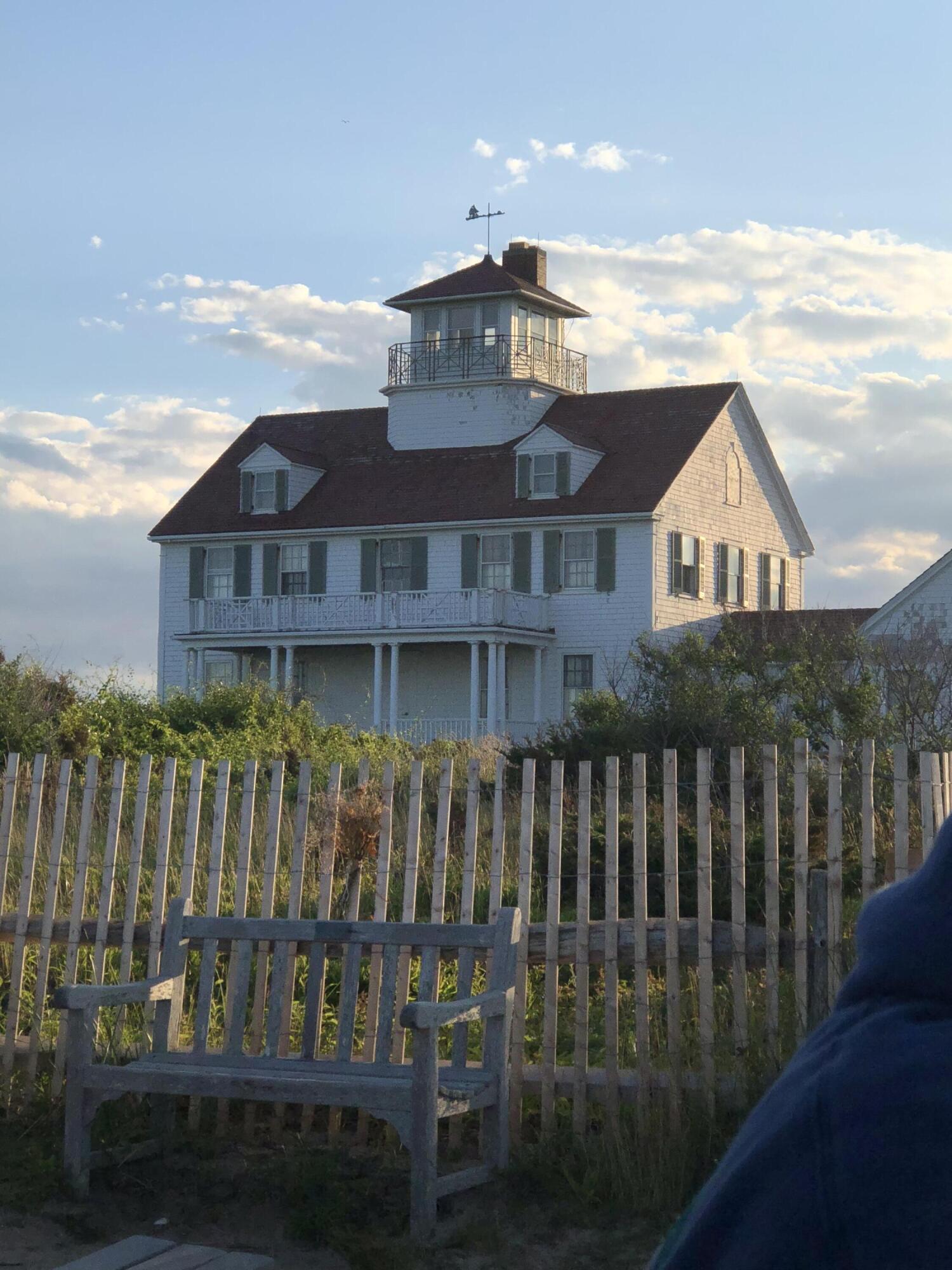 605 Cable Road Eastham, MA 02642 - Photo 24 of 25 a front view of a house with a wooden fence