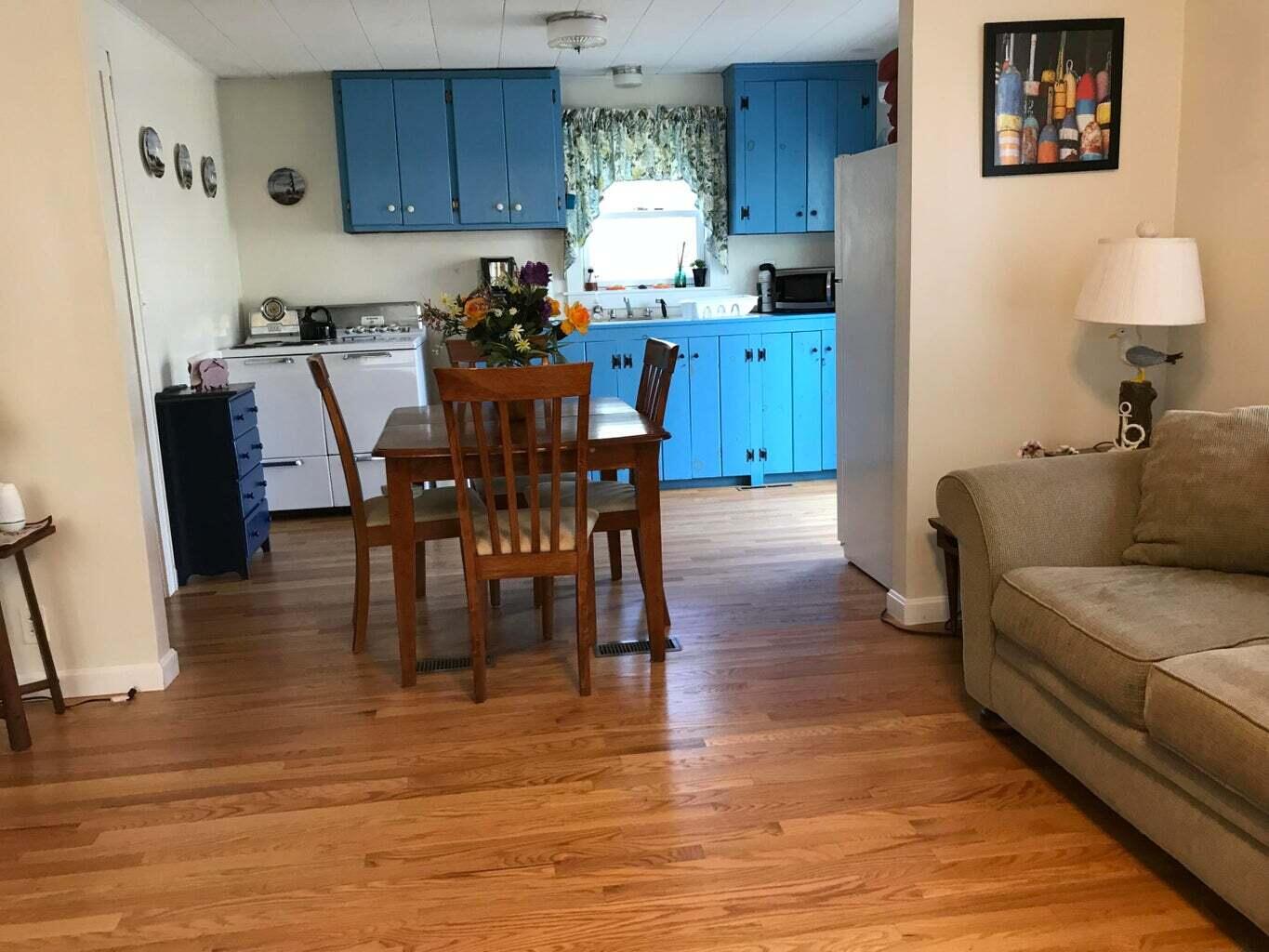 605 Cable Road Eastham, MA 02642 - Photo 6 of 25 a view of kitchen with dining table and chairs