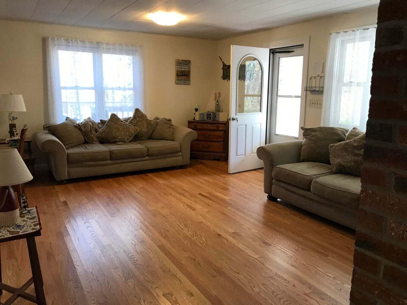 605 Cable Road Eastham, MA 02642 - Photo 7 of 25 a living room with furniture and a window