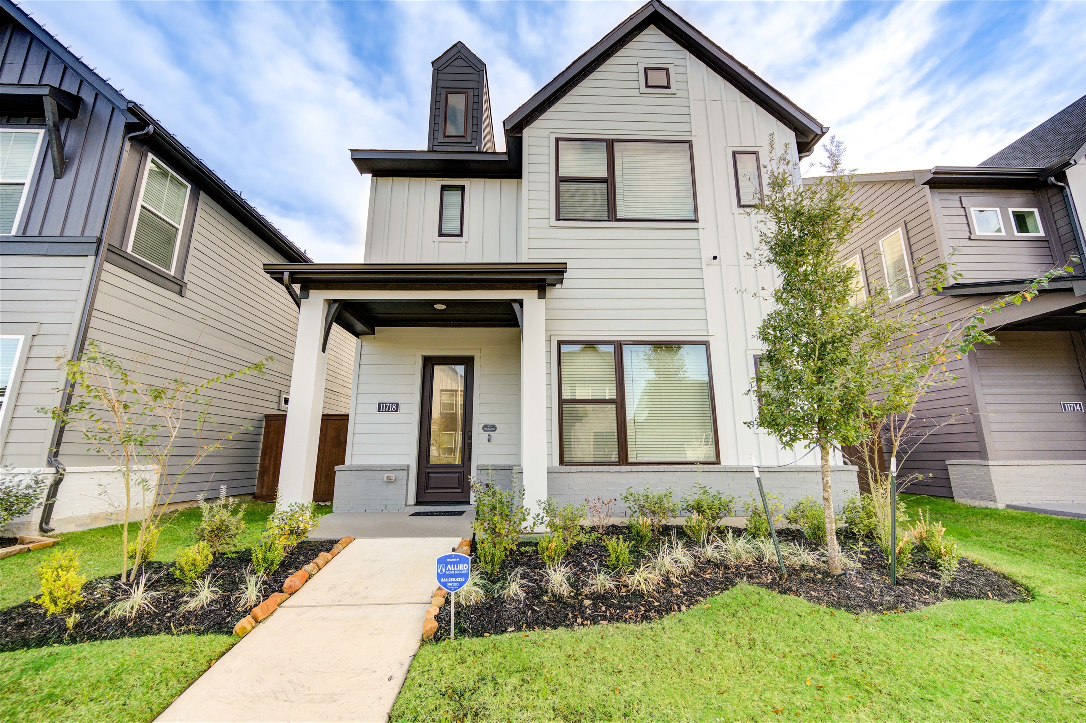 a front view of a house with a yard