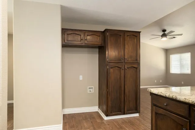 a view of a kitchen from the hallway