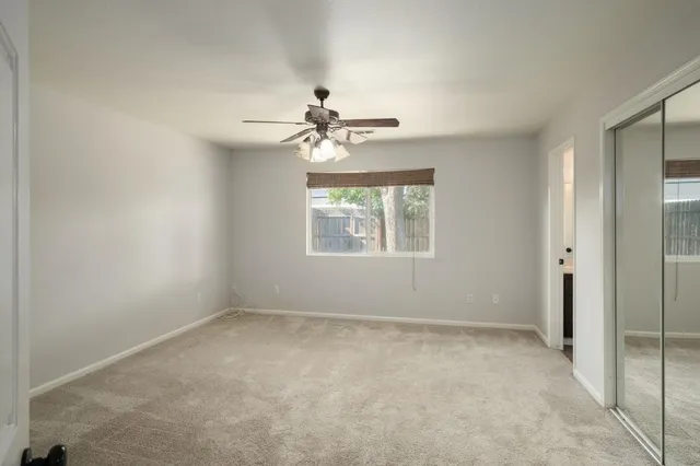 a view of an empty room with a window