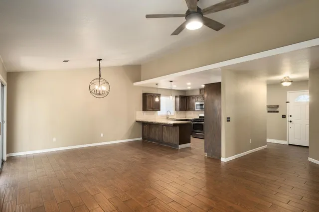 a view of a hallway with a kitchen