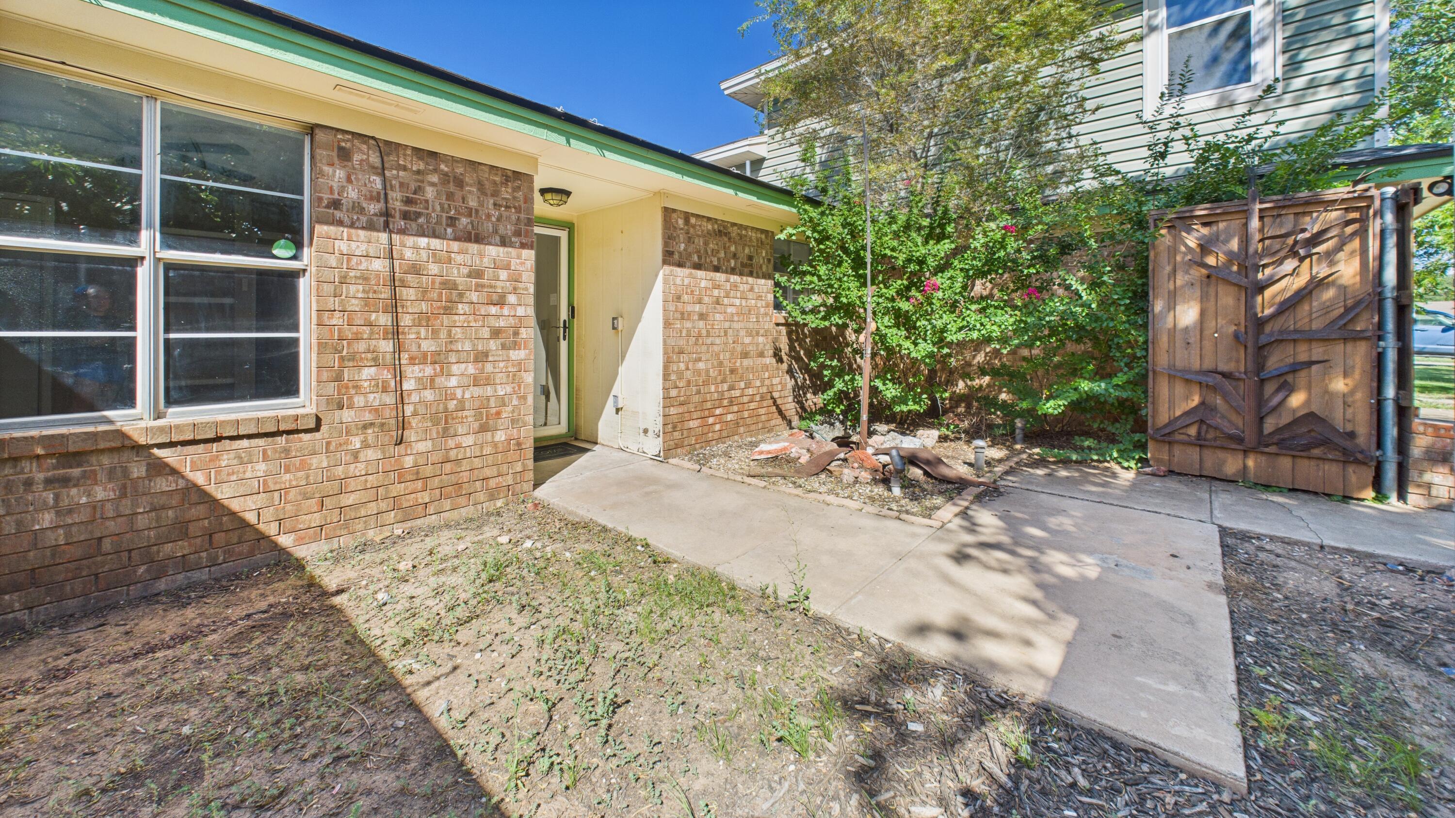 5719 2nd Street Lubbock, TX 79416 - Photo 12 of 61 a front view of a house with a yard