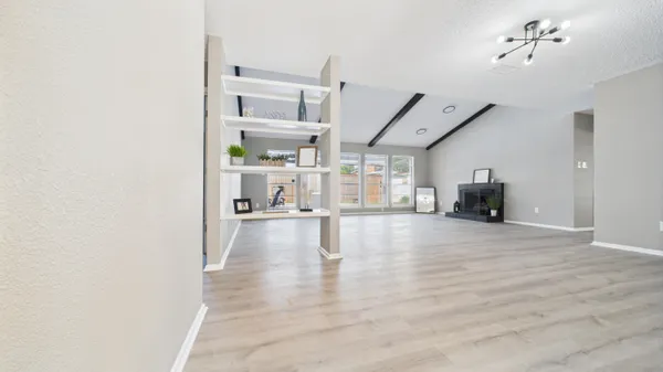 a living room with furniture and a table