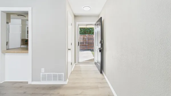 a view of livingroom with furniture and wooden floor