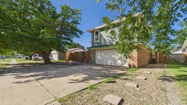 a view of a yard with a tree in the house