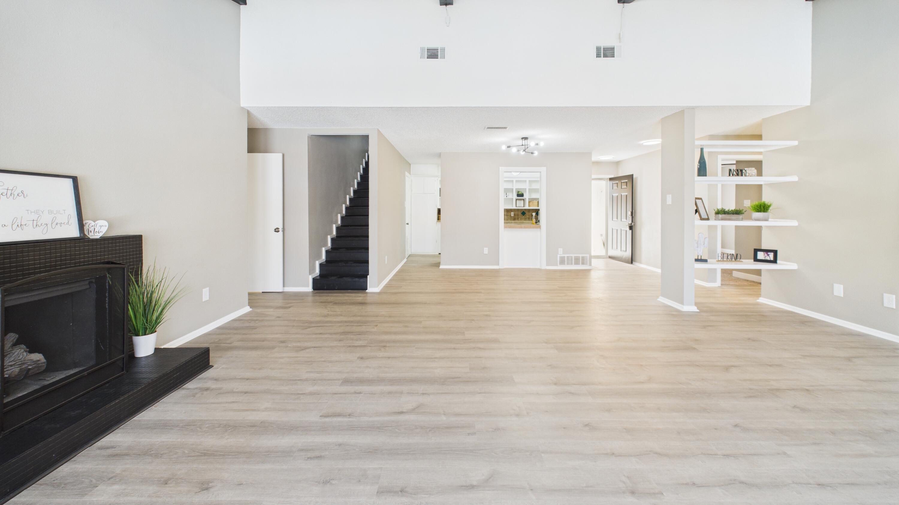 5719 2nd Street Lubbock, TX 79416 - Photo 22 of 61 a view of a livingroom with wooden floor and a fireplace