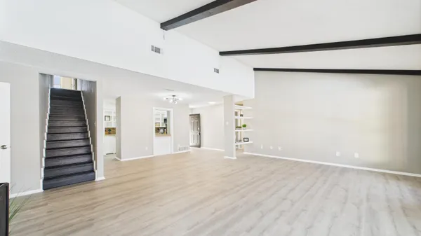 a kitchen with stainless steel appliances a stove a sink and a refrigerator