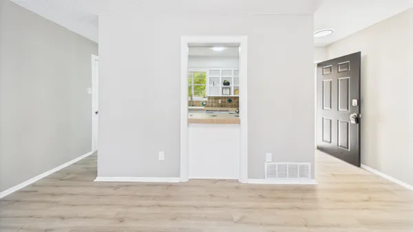 a kitchen with granite countertop a sink and a window