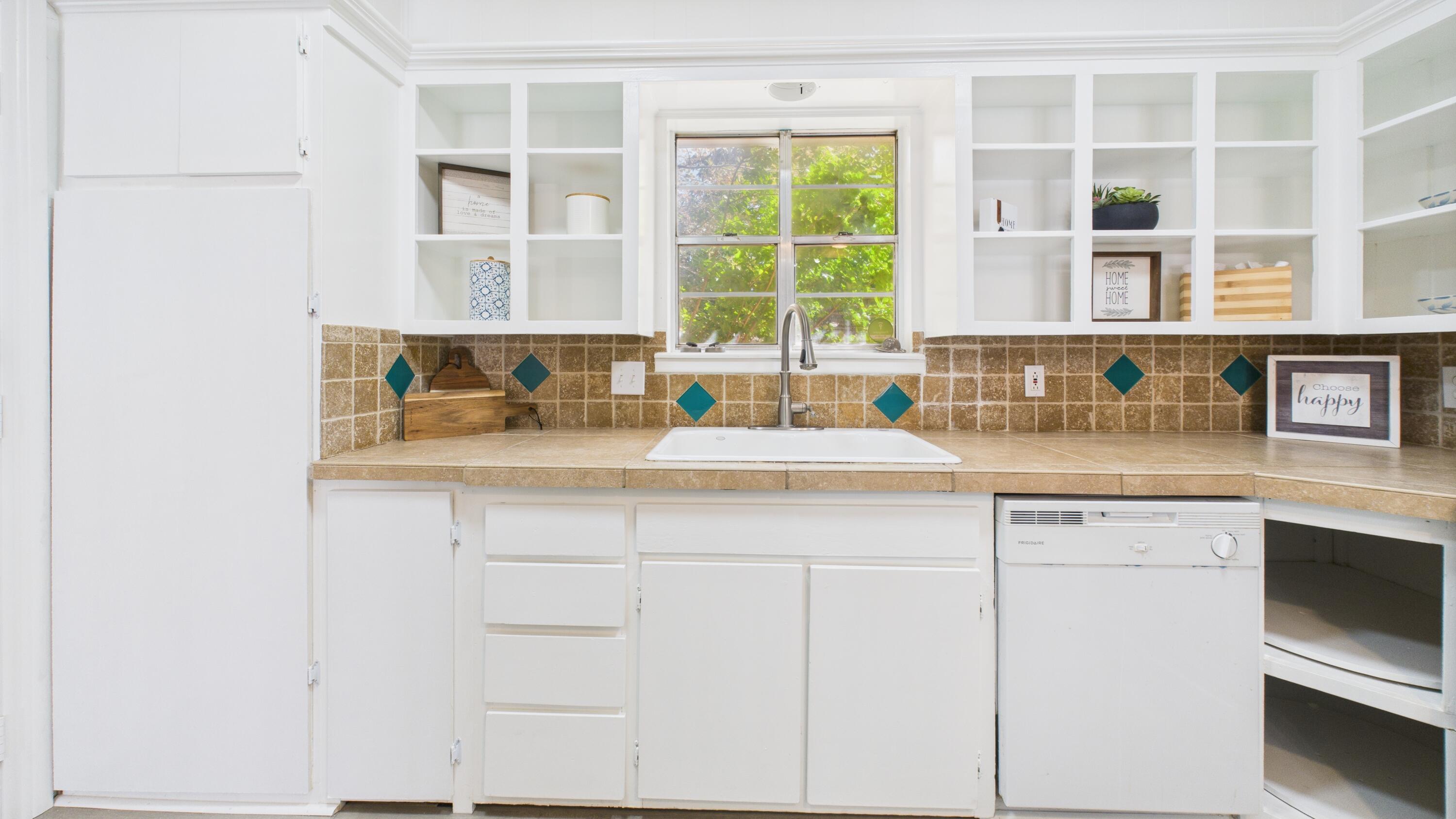 5719 2nd Street Lubbock, TX 79416 - Photo 28 of 61 a kitchen with a sink and a window