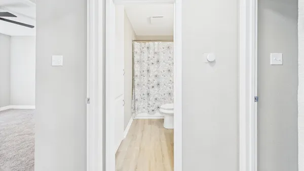 an empty room with a empty space and windows