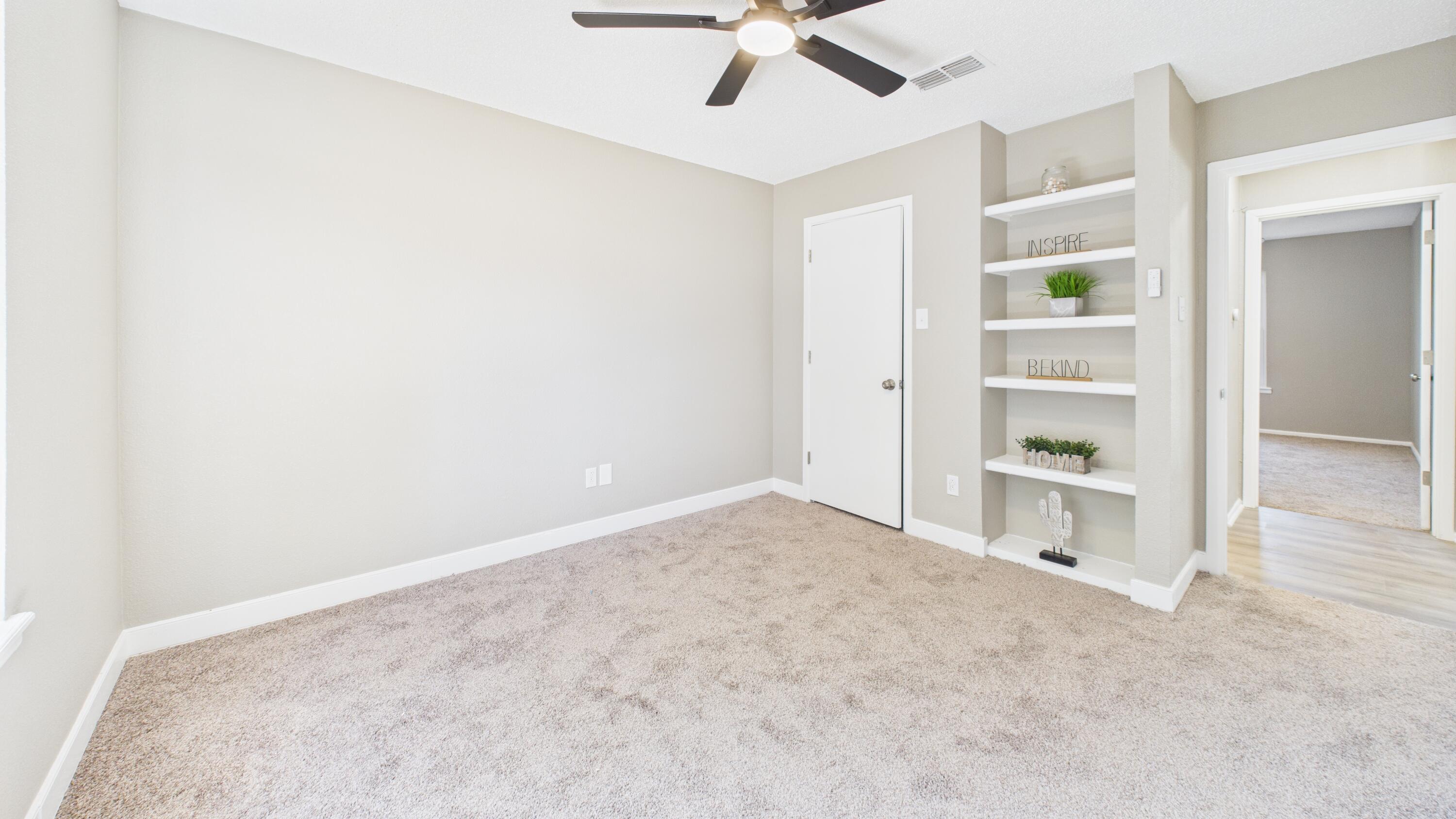 5719 2nd Street Lubbock, TX 79416 - Photo 37 of 61 an empty room with a empty space and windows